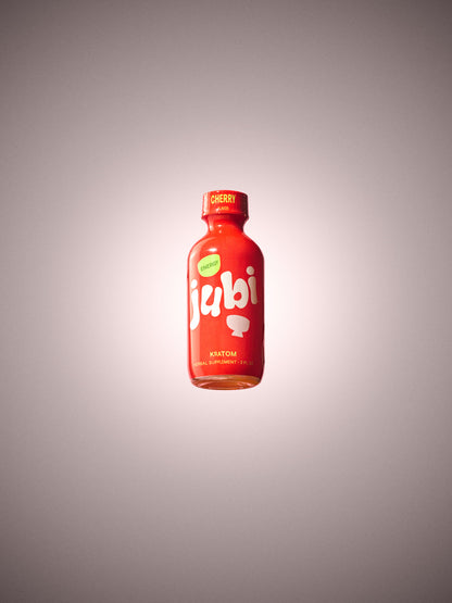 Jubi Cherry kratom shot with soft glow effect.